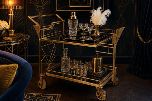 Art Deco bar cart Australia — gold geometric bar cart with crystal cocktail shaker and angular glassware styled in a moody Art Deco-inspired room