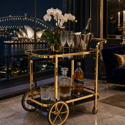 Gold bar cart Sydney — Le Versailles luxury drinks trolley in apartment with Harbour Bridge and Opera House view at night