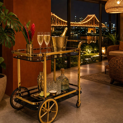 Gold bar cart Brisbane — Le Versailles two-tier drinks trolley in premium home with Story Bridge view at night