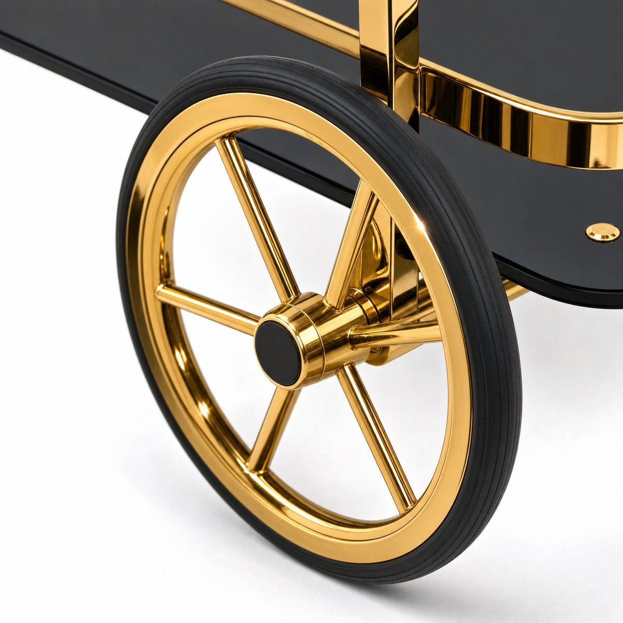 Close-up of Le Versailles gold bar cart decorative rubber spoke wheels and front swivel casters