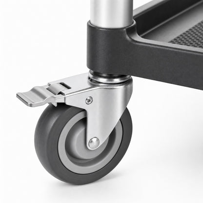 Close-up of commercial utility cart Graphite Grey silent rubber caster with foot-operated locking brake