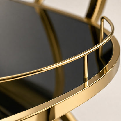 Close-up of Teneriffe gold bar cart black glass shelf with protective gold guardrails