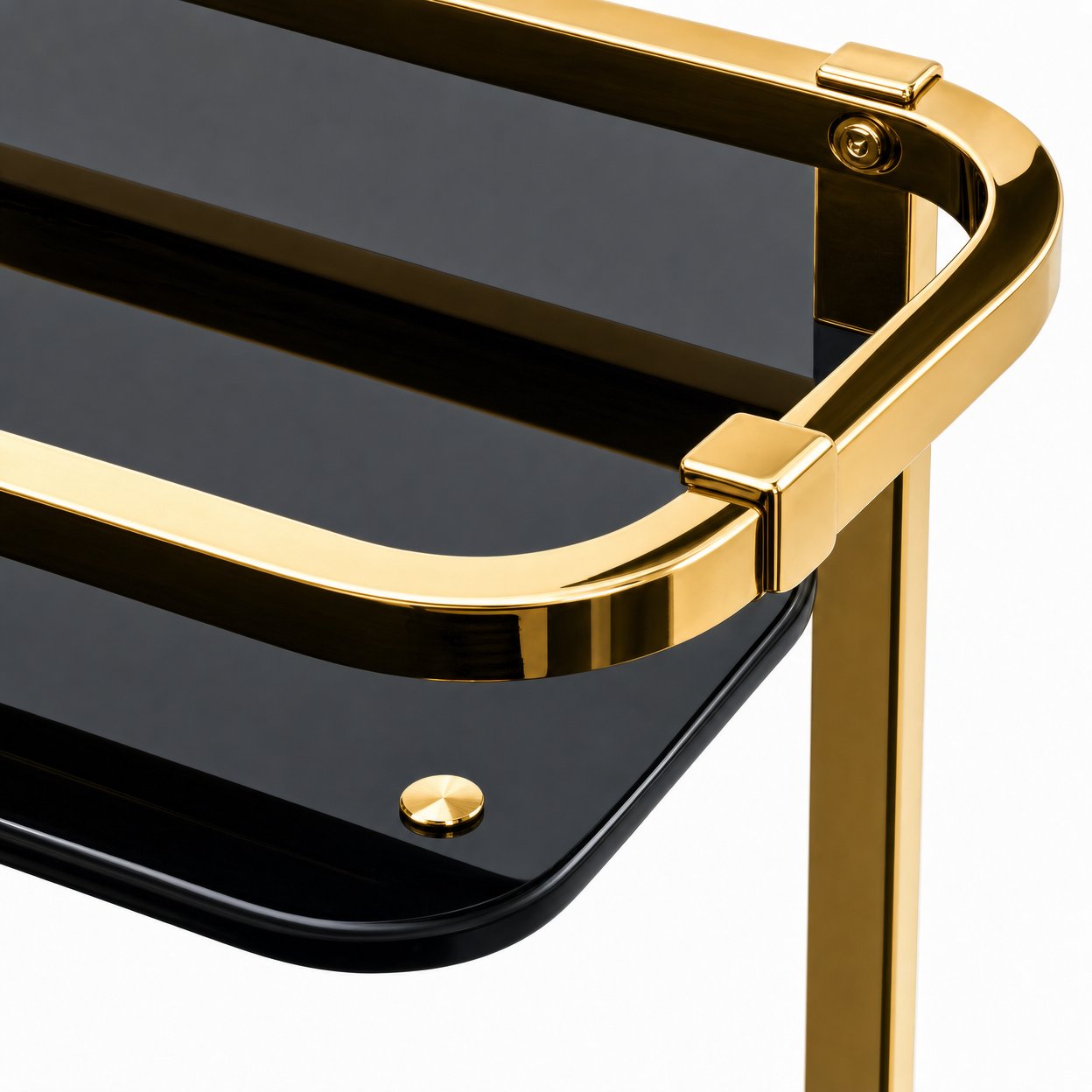Black glass shelf detail of Le Versailles two-tier gold bar cart showing protective gold guardrails on both tiers