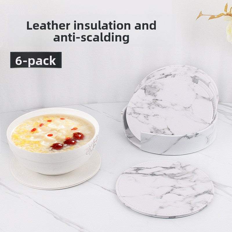 Round leather placemat set of 6 with storage caddy, shown protecting a table from a hot bowl — heat insulated and anti-scald