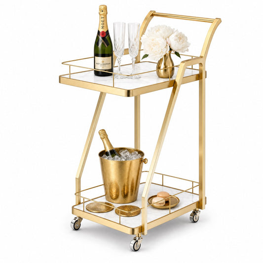 The Mosman Two-Tier Gold Marble-Look Service Cart featuring a striking Z-frame and white faux-marble shelves, styled with wine and glasses and day spas.