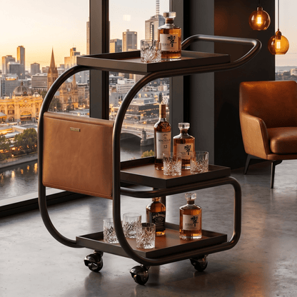 Close-up of La Milano Three-Tier Leather Bar Cart showcasing black metal frame and brown leather shelves in a modern living space.