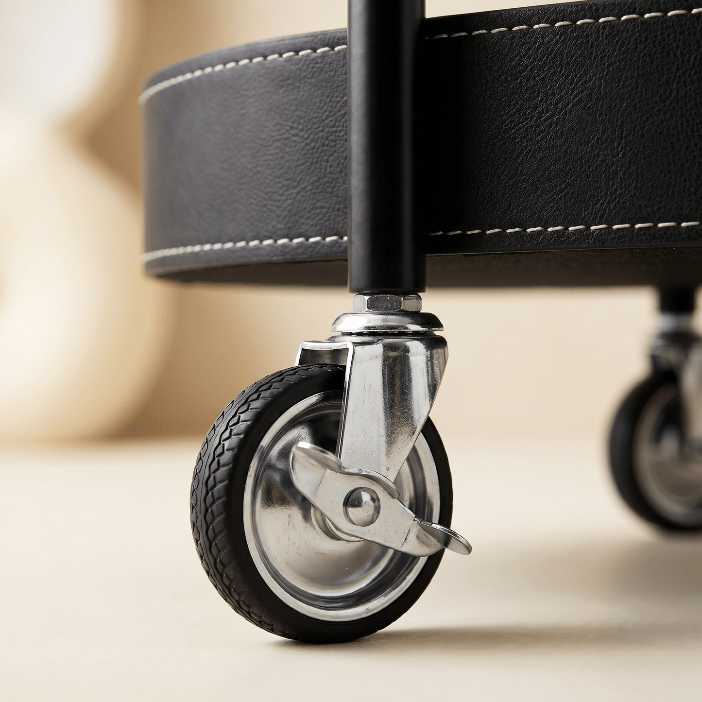 Close-up of Royal Bar Carts Le Provence Iron and Leather Side Trolley showcasing black leather straps and iron frame details in a modern indoor setting