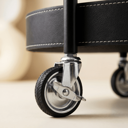 Close-up of Royal Bar Carts Le Provence Iron and Leather Side Trolley showcasing black leather straps and iron frame details in a modern indoor setting