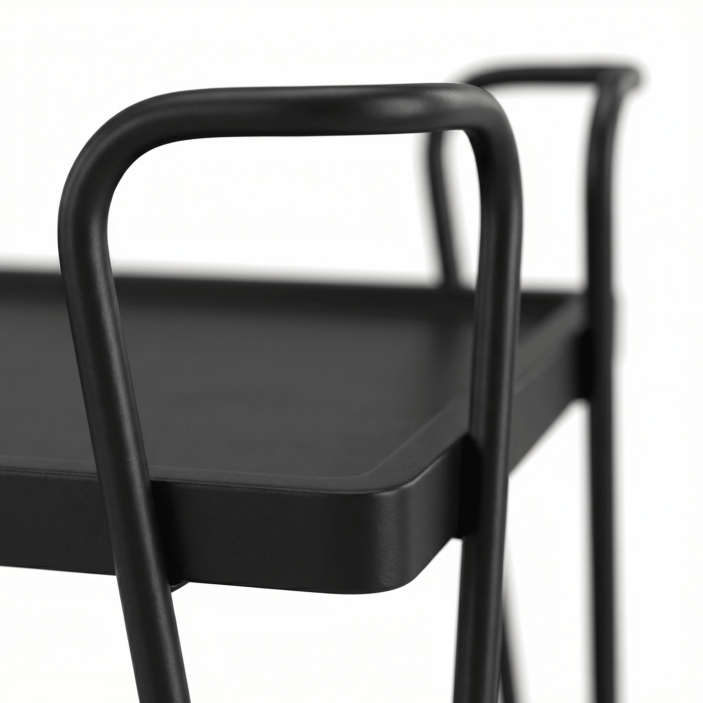 Close-up of The Ascot Vale Two-Tier Retro Serving Cart’s black frame and brown shelves styled with glassware in a contemporary setting