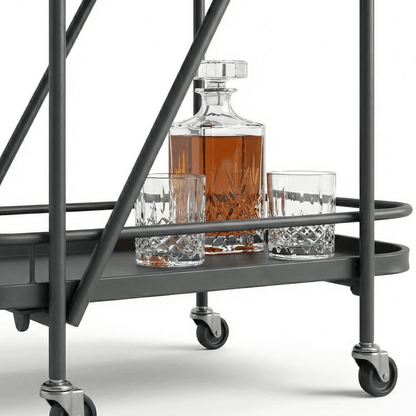 Close-up of the Brighton Two-Tier Metal Service Cart in black, styled with coastal deco accents by Royal Bar Carts.