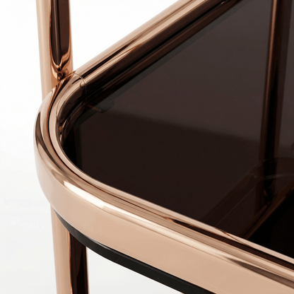 Close-up of The Collins Two-Tier Beverage Cart’s gold frame and glass shelves styled with cocktails and barware in a modern deco setting