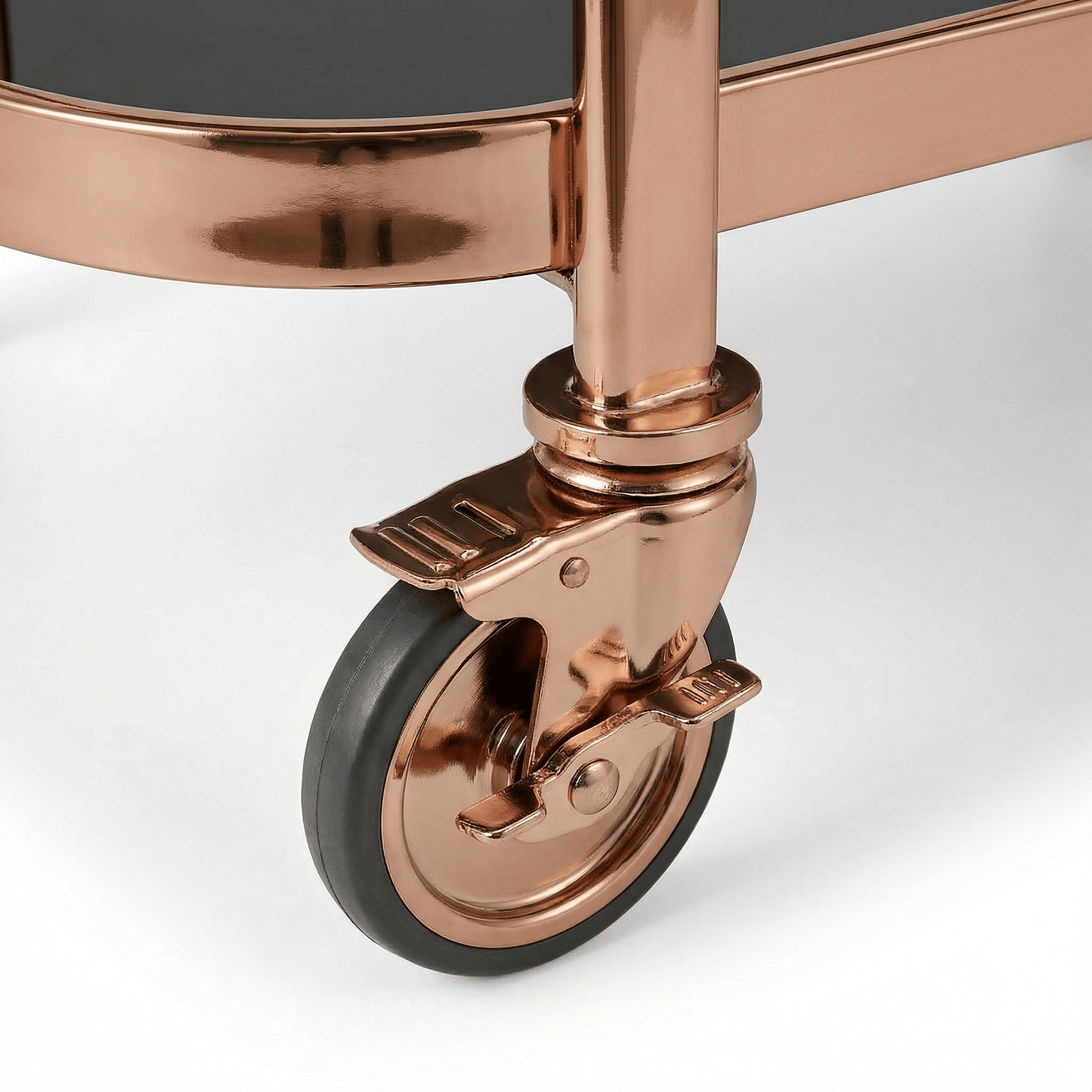 Close-up of the Collins Two-Tier Beverage Cart’s gold frame and glass shelves styled with elegant barware and deco accents.