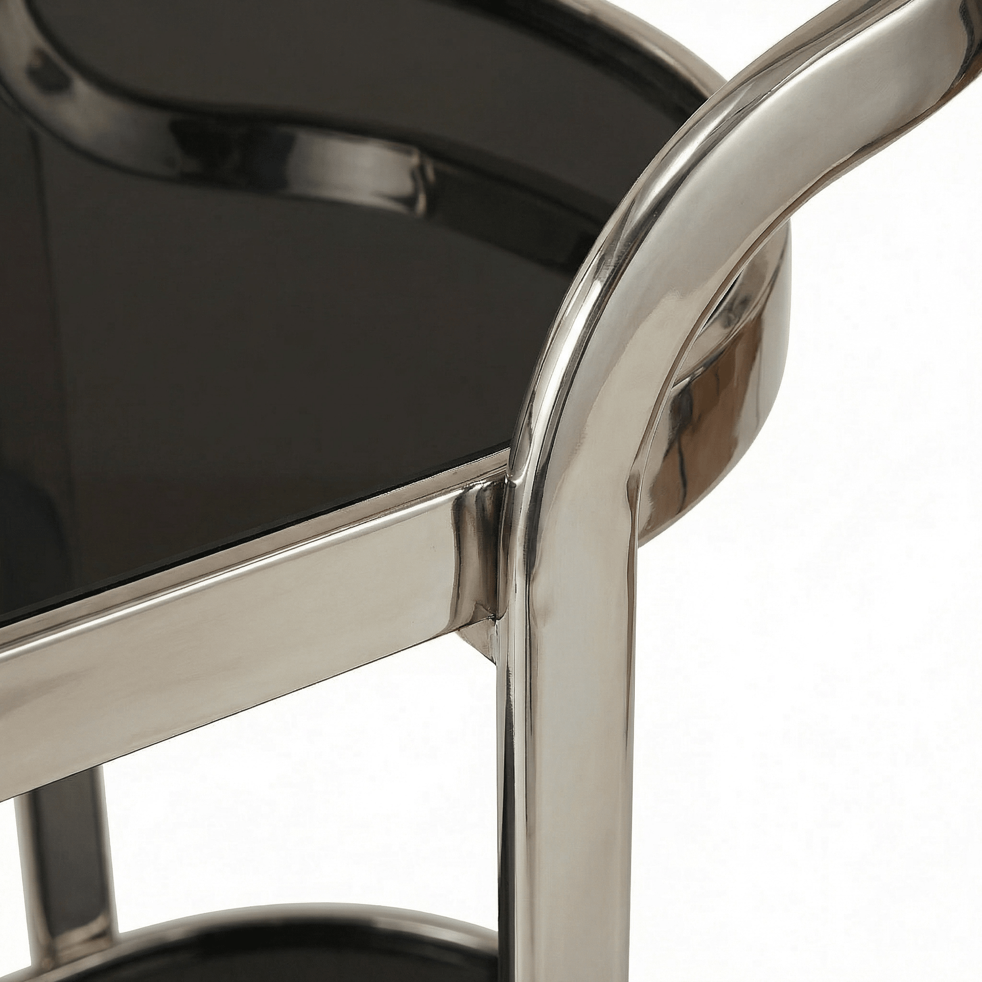 Close-up of The Collins Two-Tier Beverage Cart by Royal Bar Carts showcasing gold frame and glass shelves with stylish deco accessories.