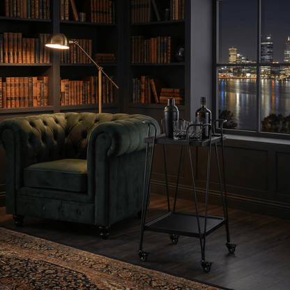 The Double Bay Two-Tier Retro Iron Trolley in black with black accents styled with glassware and decor in a contemporary setting