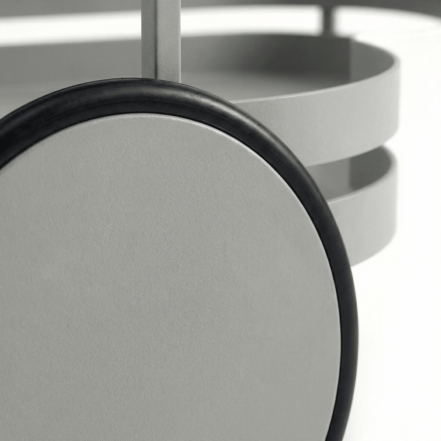 Close-up of the Kirra Nordic Oval Bar Cart in Gray, styled with glassware and coastal deco accents, showcasing its sleek design.
