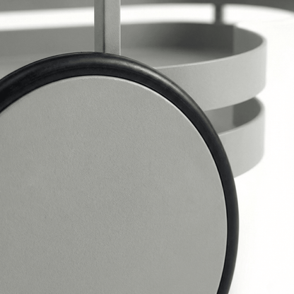 Close-up of the Kirra Nordic Oval Bar Cart in Gray, styled with glassware and coastal deco accents, showcasing its sleek design.