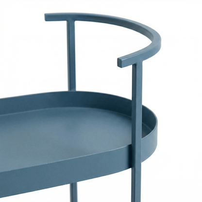 The Kirra Nordic Oval Bar Cart in blue, styled with coastal deco accents in an elegant living space.