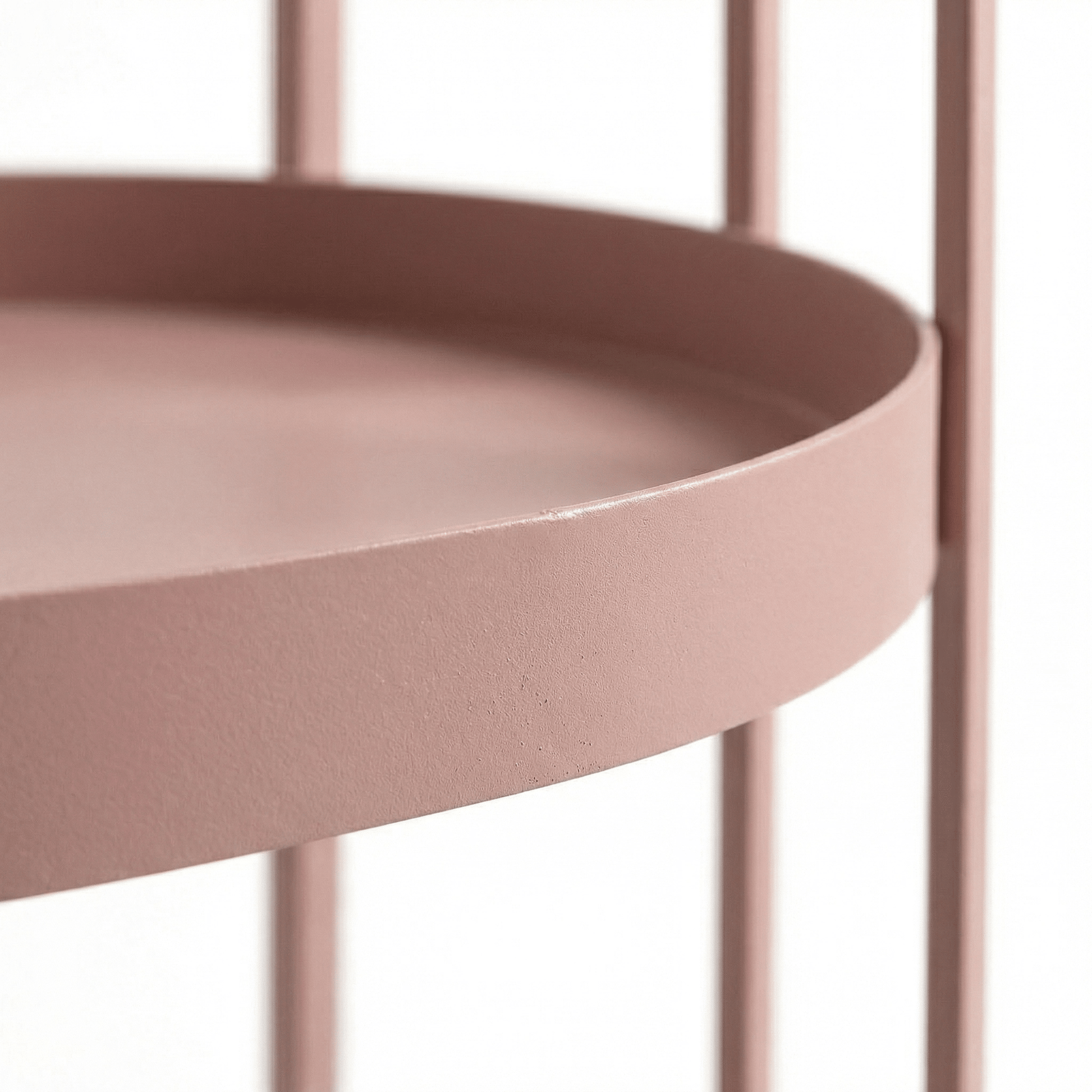 Close-up of The Kirra Nordic Oval Bar Cart in pink, styled with coastal decor and glassware, showcasing its sleek frame and handles.