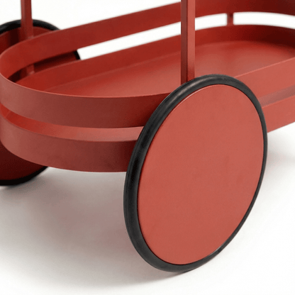 Close-up of The Kirra Nordic Oval Bar Cart by Royal Bar Carts showcasing red deco and Gatsby style details
