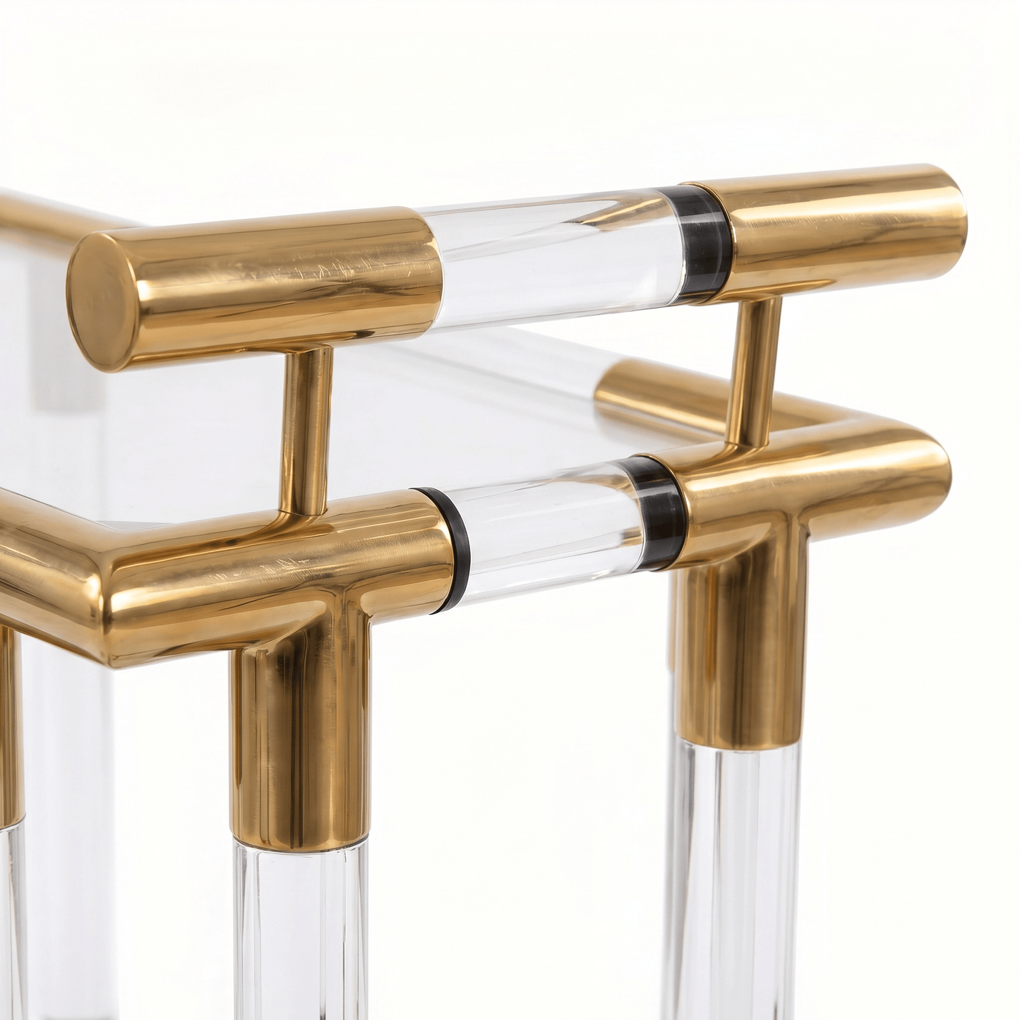 Close-up of the Lake Mackenzie two-tier acrylic bar cart showcasing gold frame and elegant deco styling by Royal Bar Carts.