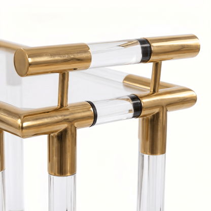 Close-up of the Lake Mackenzie two-tier acrylic bar cart showcasing gold frame and elegant deco styling by Royal Bar Carts.