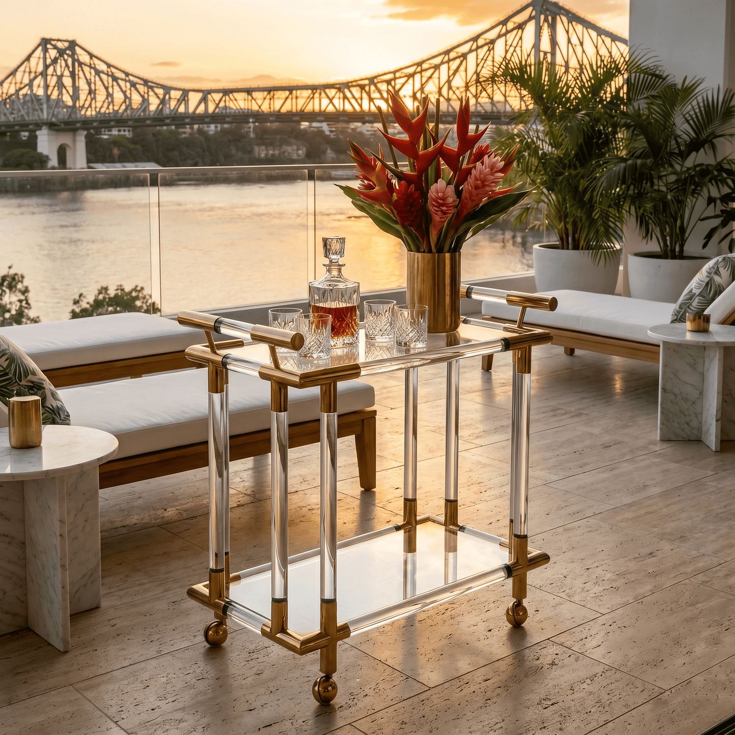 The Lake Mackenzie acrylic bar cart with champagne — two-tier gold acrylic trolley