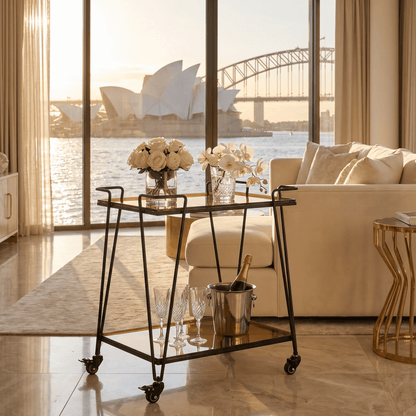 The Neutral Bay glass bar cart with drinks display — two-tier gold glass trolley