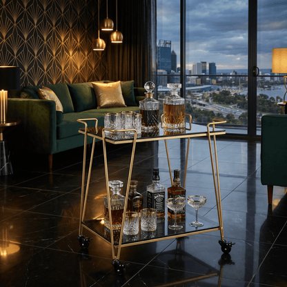 The Neutral Bay two-tier glass bar cart — gold frame with black glass shelves, bar trolley Australia