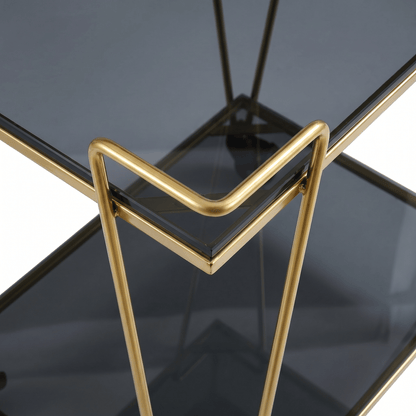 Close-up of The Neutral Bay Two-Tier Glass Bar Cart by Royal Bar Carts showcasing sleek gold frame and stylish deco details