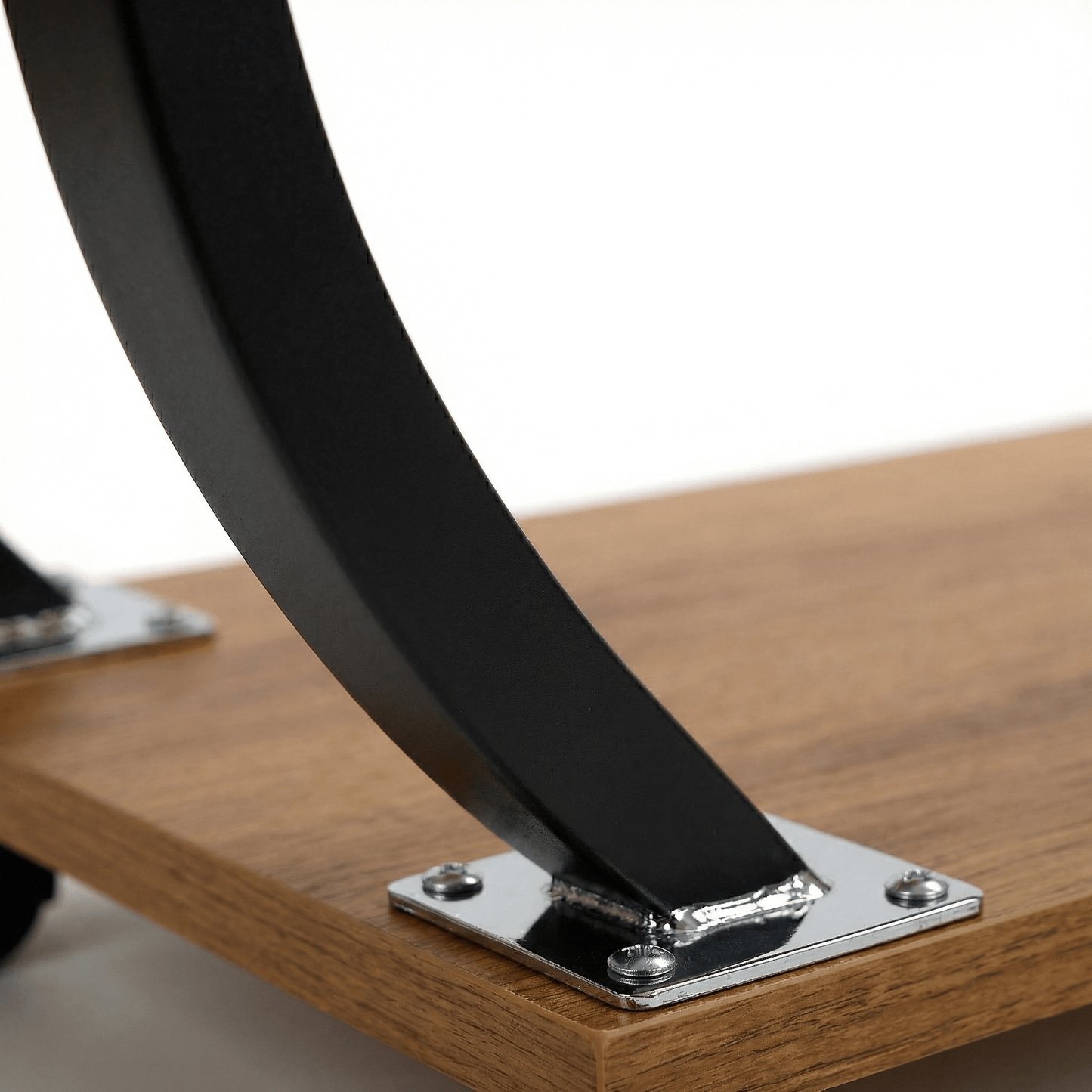 Close-up detail of Noosa Curved Metal Sofa Table black C-shape frame and coastal deco styling — Royal Bar Carts Australia