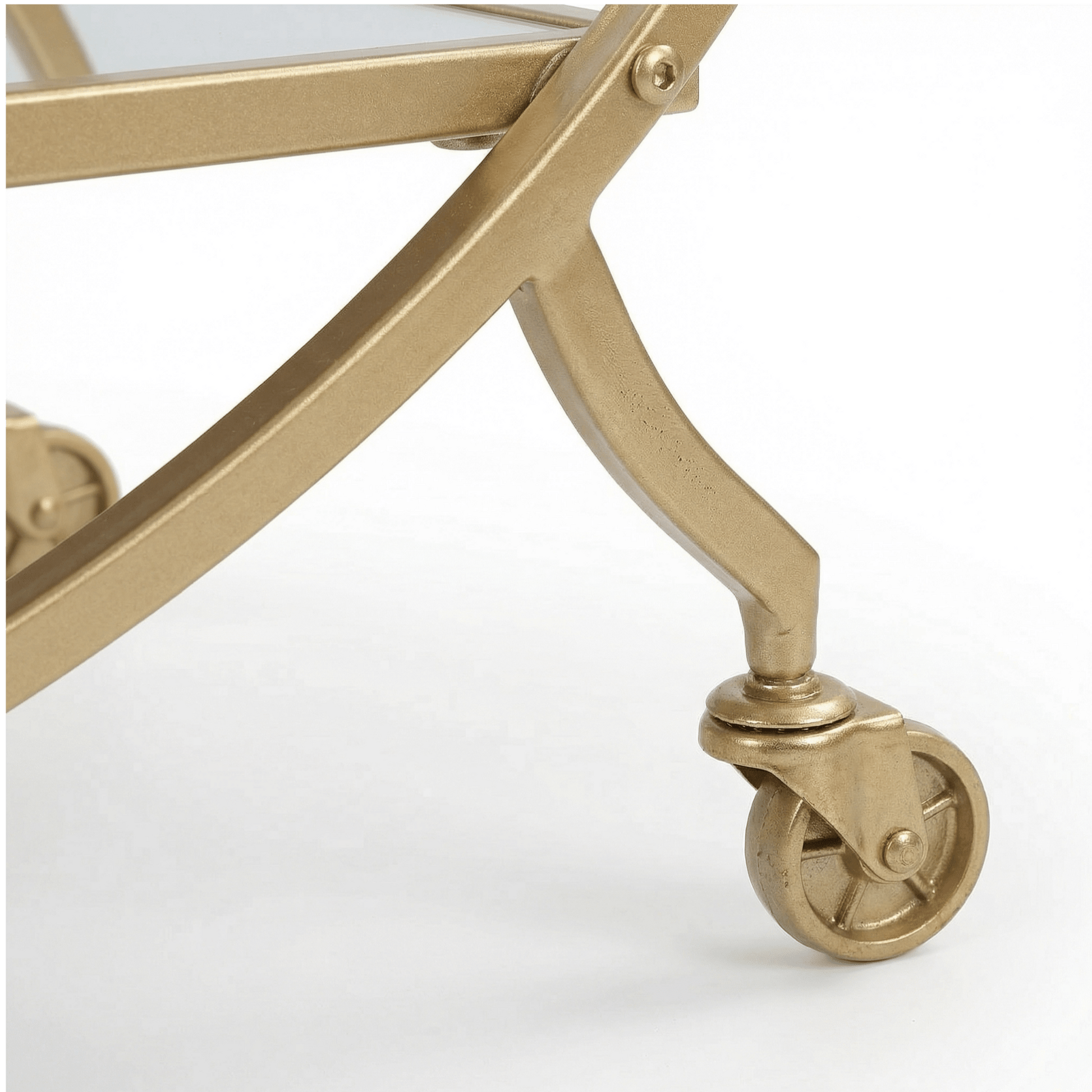 Close-up of The Orion Gold Circle Bar Cart’s glass shelves and gold frame, styled with elegant glassware by Royal Bar Carts.
