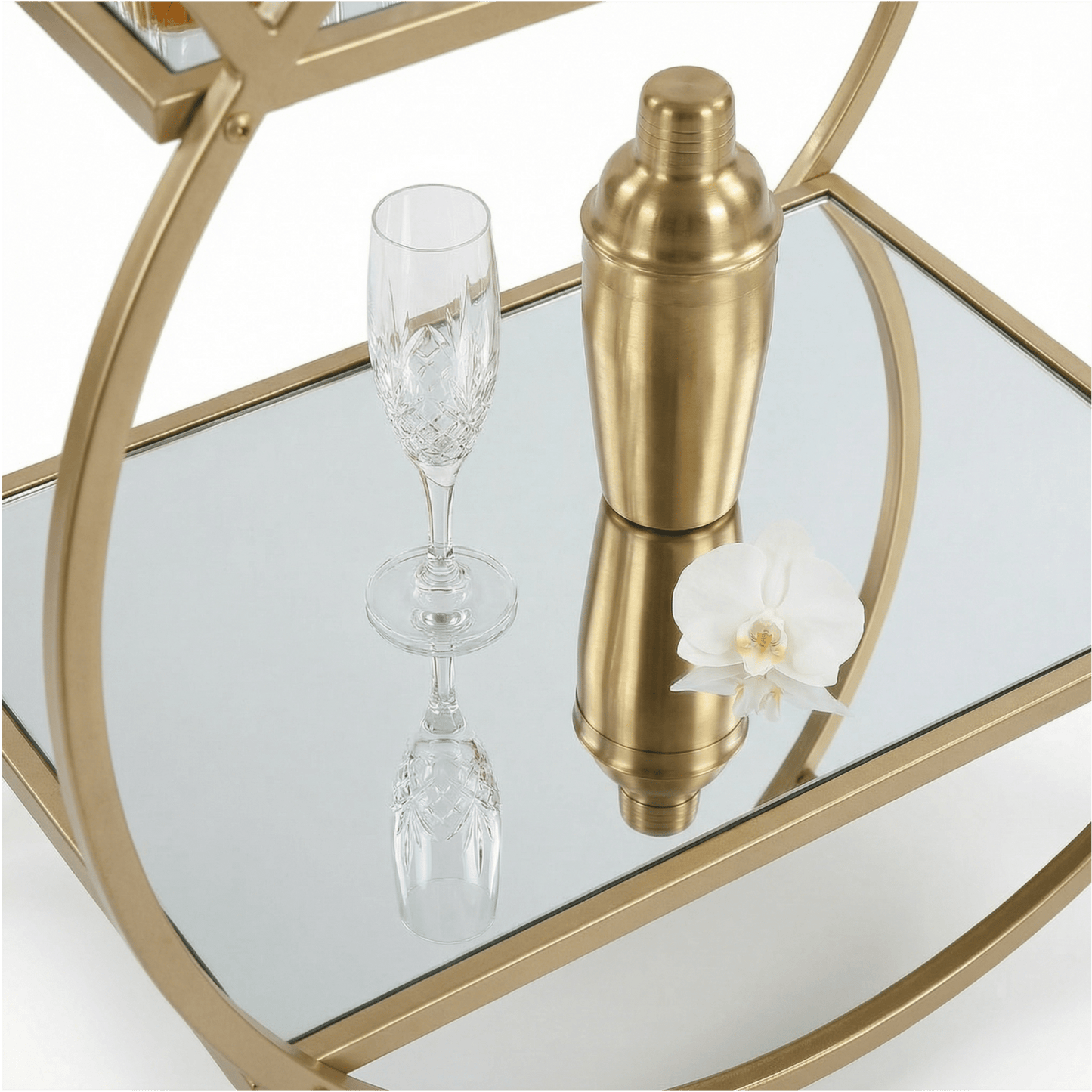 Close-up of the Orion Gold Circle Bar Cart’s glass shelves and gold frame showcasing contemporary deco style by Royal Bar Carts