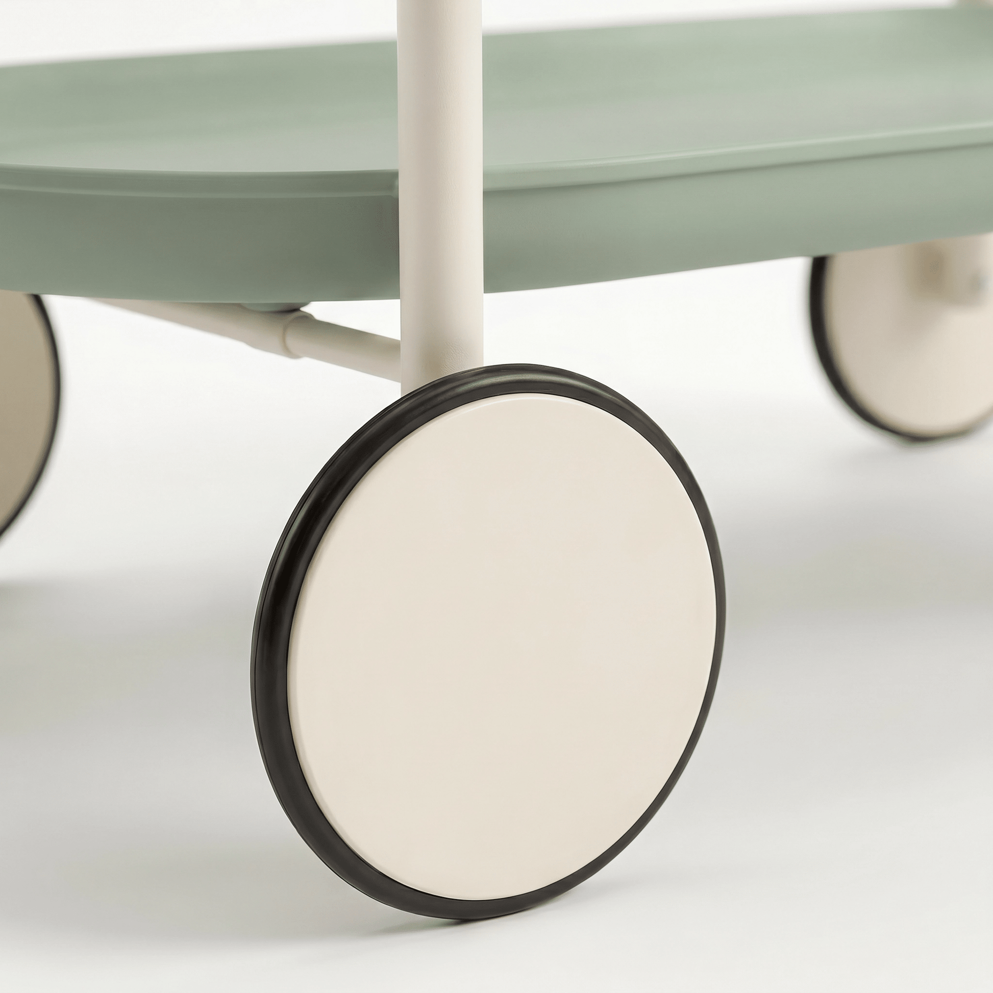 Close-up of the green ABS two-tier Surry Hills bar trolley showcasing coastal deco styling and sleek rolling design by Royal Bar Carts