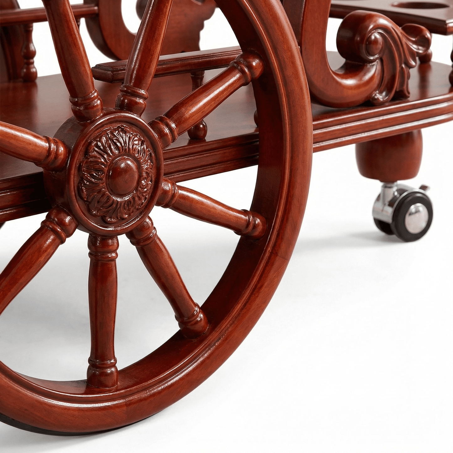 Close-up of The Tasman Ornate Wood Bar Trolley’s intricate wood detailing and brass accents in a stylish home setting